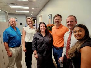 Group of smiling people at the Avery Hall Business After Hours