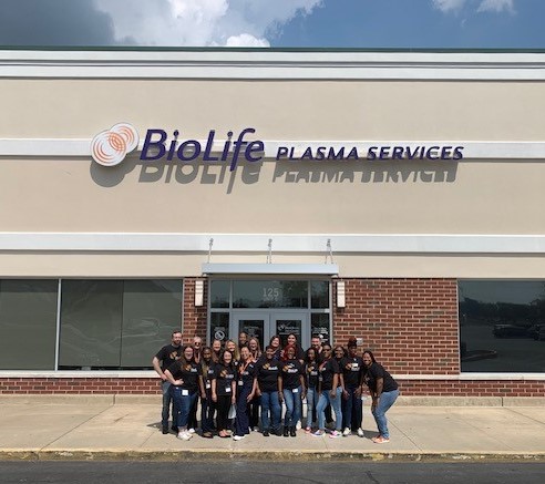 group of people standing outside building