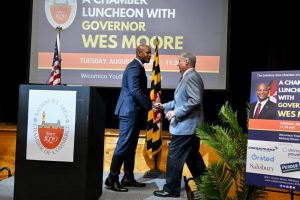 governor wes moore shaking hands with a man