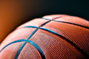 Close up of a basketball with a black background