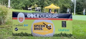Large banner in the grass for the 2023 SACC Golf Classic Presented by Spicers Bros.