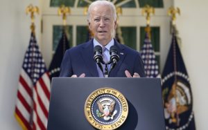 President Joe Biden speaking at the podium in front of the White House in Washington DC