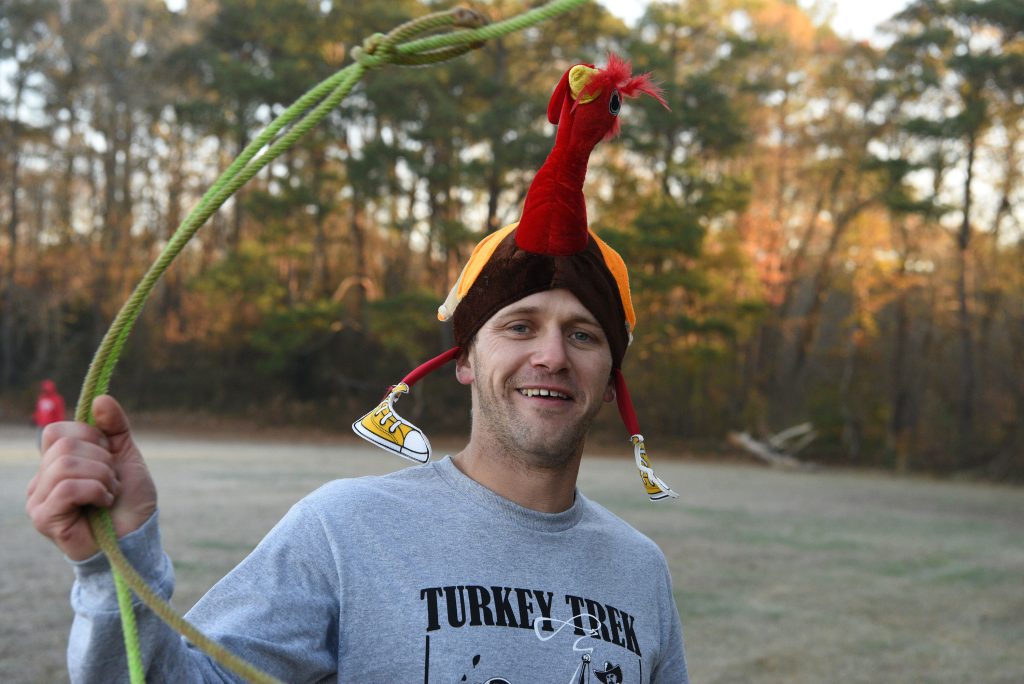 Young man wearing a turkey hat during the 5K race