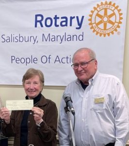 old man and woman holding the winning ticket for the Salisbury Rotary raffle