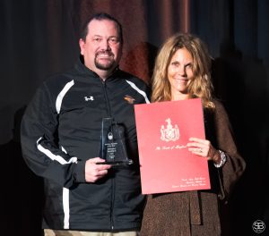 Lora Walinskas of Effectv presents the Medium Business of the Year Award to Chris Bitter, The Delmarva Shorebirds