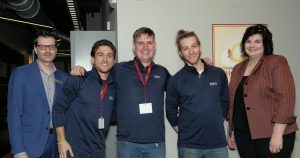 Five people standing in the hallway of one of the Salisbury University buildings