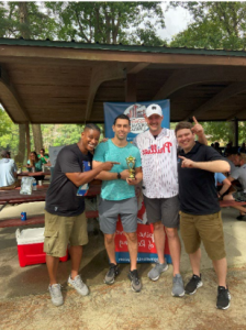 First Place disk golf team holding a trophy