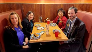 Family of four dining in a boot at the Fuji Ramen House