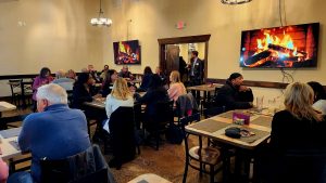 Group of people sitting at tables