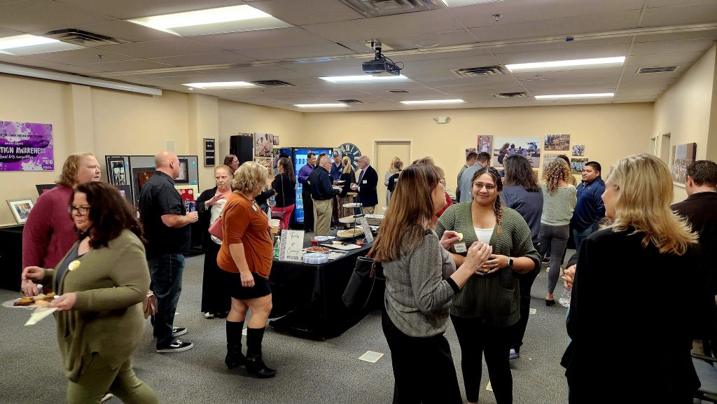 Men and women mingling at a networking event