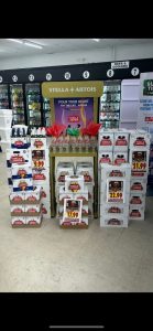 Interior of a liquor store with stacked bottles of booze