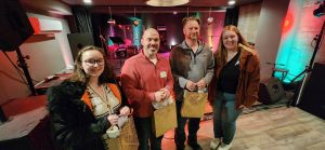 Group of four standing inside AMP Studio in Salisbury, MD