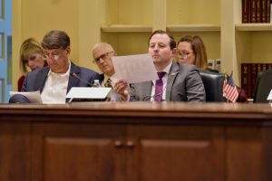 Congress men and women reviewing documents