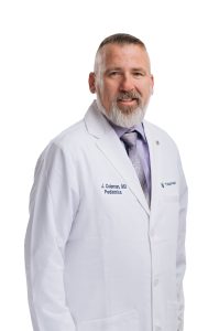 Headshot of a doctor in a white coat from TidalHealth