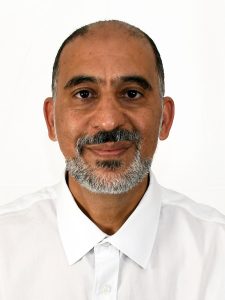 Headshot of an adult male with facial hair