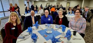 Chamber members gathered around a circular table