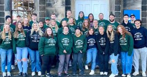 Large group of Salisbury University students standing on steps in Scotland