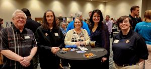 Men and women at the Coast Chamber Mixer 2024