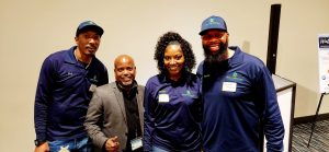 Four people standing together at the Chamber Mixer event