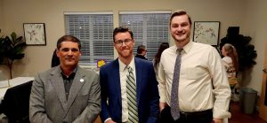 Three men dressed in business attire