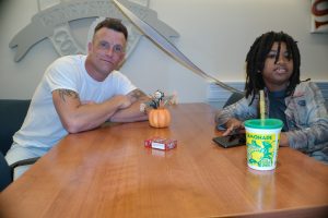 Joseph Ewing and his Little Brother sitting at a table together