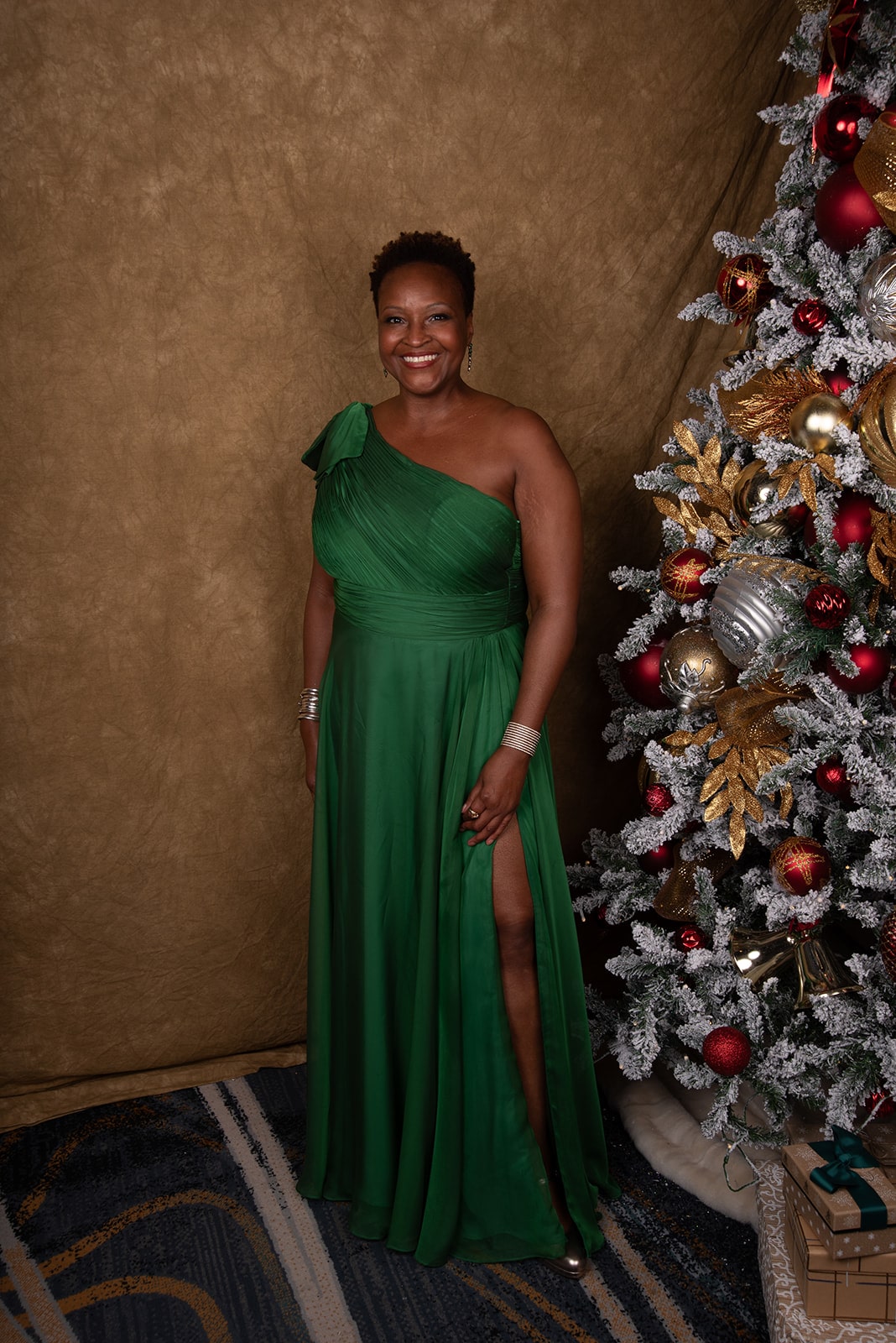 African American female wearing an emerald green gown
