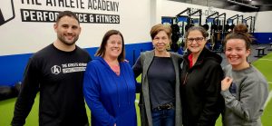 Men and women at the Athlete Academy