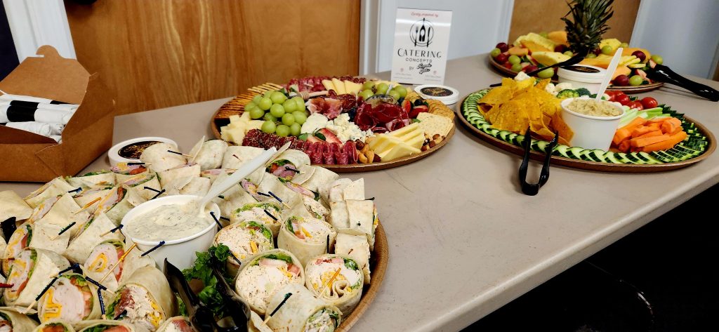 Food table at the ribbon cutting party