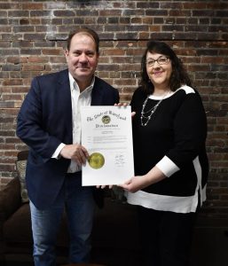 Salisbury Mayor Randy Taylor and the city’s Secretary of Kindness, Heather Brooks, hold Gov. Wes Moore’s proclamation declaring Feb. 11-17 Kindness Week in Maryland.