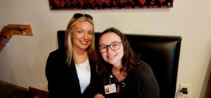 two females attending the ribbon cutting event at Guidos