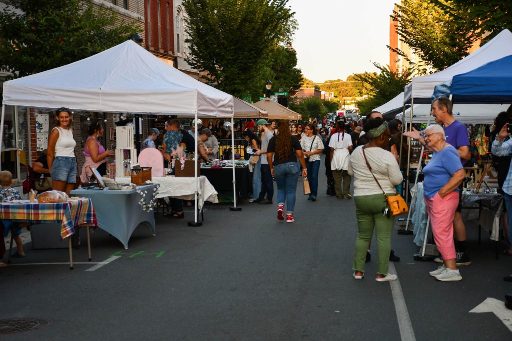 People browse vendors during a 3rd Friday event in 2023. 