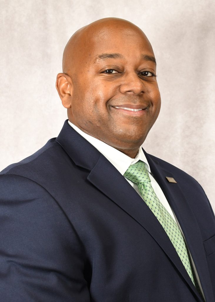 Headshot of an African American male in a suit and tie
