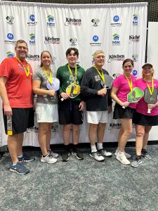 Group of men and women at a pickleball tournament