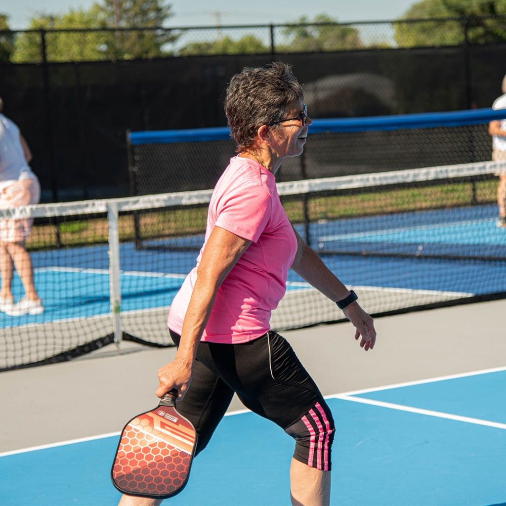 Female pickleball player on the court