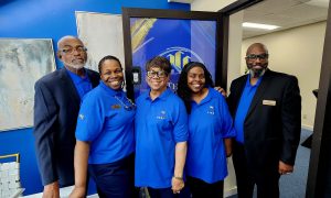 Group of people in blue matching shirts