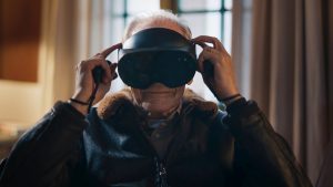 Old man wearing virtual reality goggles