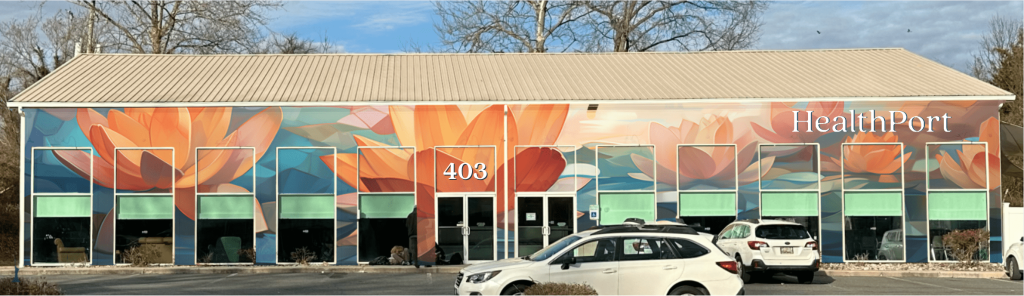 Exterior of new Healthport building with cars in front