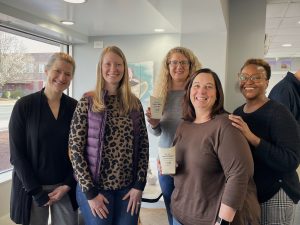 Group of females at an award ceremony