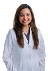 Headshot of a female doctor from Tidal Health