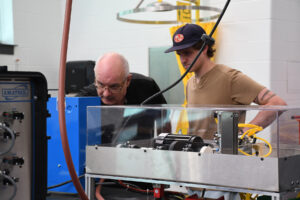 student and professor working together in a lab