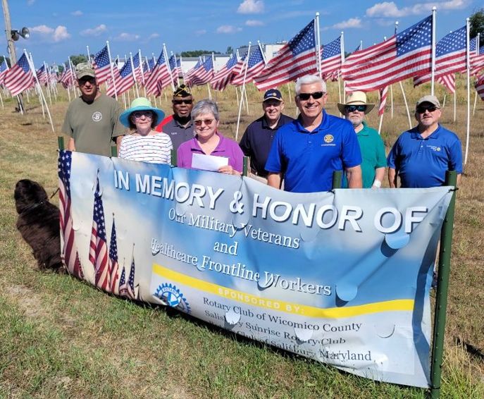 Rotarians and their supporters have donated $4,000 to local veterans and active duty military personnel support organizations through the Flags for Heroes display east of Salisbury this spring and summer.  Shown, left to right, are Chris Hardy with U.S. Kennels, Inc.; Barbara Leonard with the Rotary Club of Salisbury; Commander Larry Jackson with the DAV Eastern Shore Chapter 34; Diana Merritt of Operation We Care; Rotary Club of Salisbury member Phil Whitman; Rotary Club of Wicomico County member Steve Mason, Ken Montville with the Rotary Club of Salisbury; and Don Murphy with the Salisbury Sunrise Rotary Club.