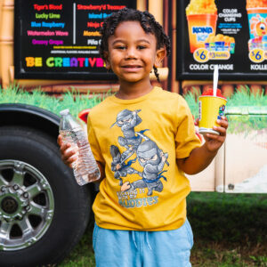 little boy holding icecream and water