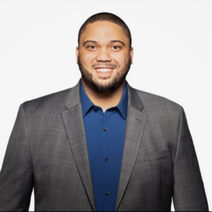 Headshot of an African American man in a suit