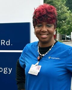 HEadshot of a female nurse in scrubs 