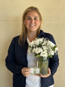 Female nurse holding flowers