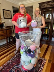 Two females holding toys