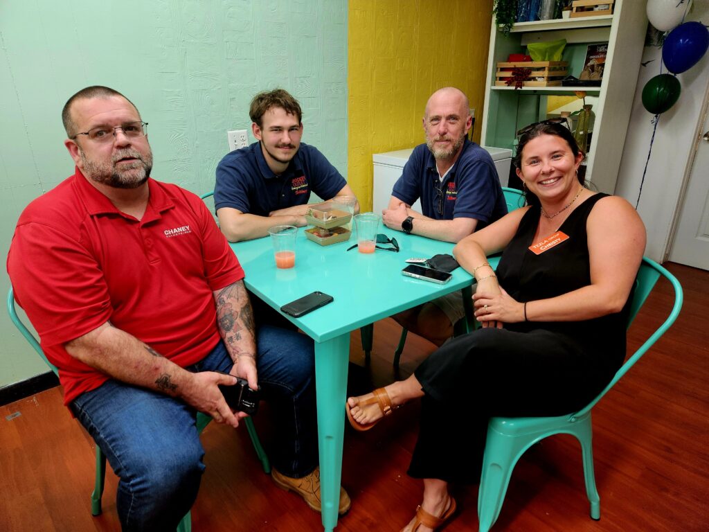 Four people sitting around a table