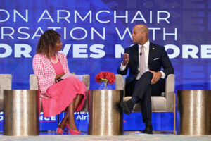 Governor Wes Moore interviewing with a girl dressed in pink