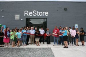 Large group of people outside of a Restore