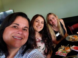 Selfie of three women smiling for the camera